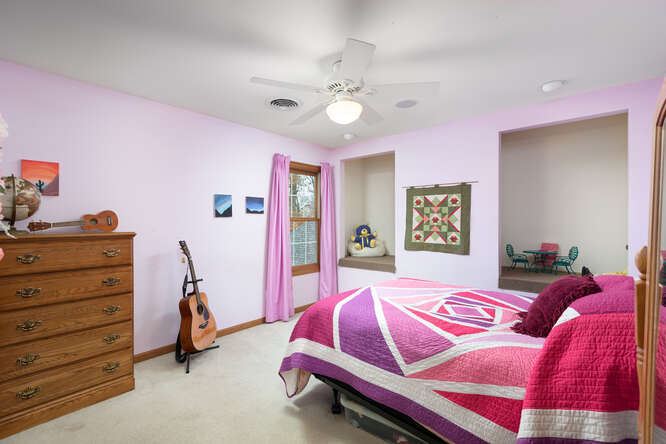 2658 East 1559th Road Ottawa, IL 61350 - Photo 43 of 53 a bedroom with a bed and a chandelier