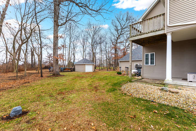 2658 East 1559th Road Ottawa, IL 61350 - Photo 7 of 53 a view of a house with a yard covered in snow