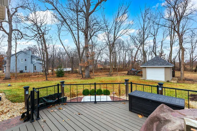 a view of a house with pool and a yard with furniture