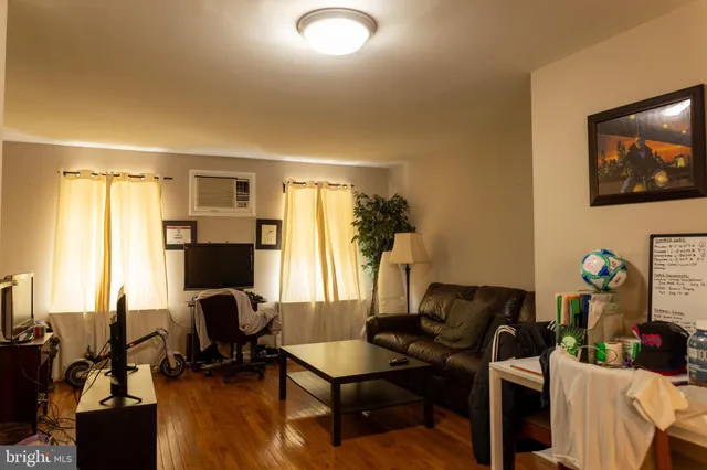 a kitchen with granite countertop a sink and a refrigerator