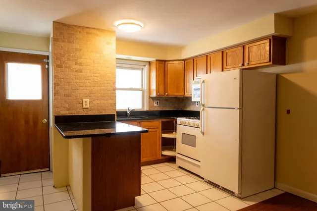 a view of a livingroom with furniture and wooden floor