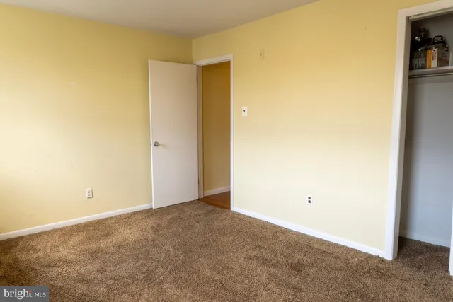 a view of wooden balcony with a floor to ceiling window and wooden floor