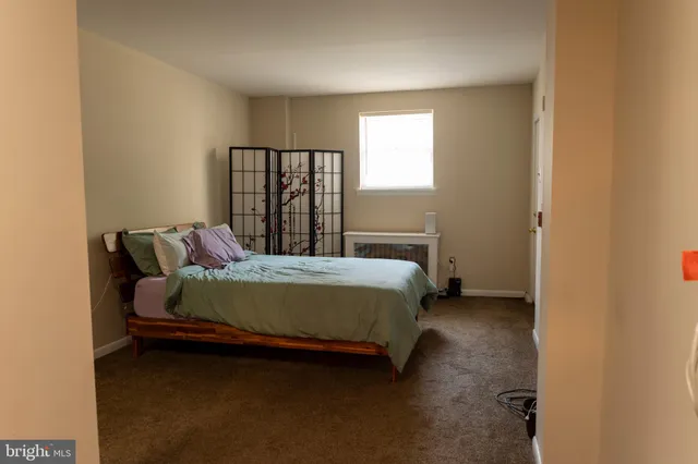 a view of walk in closet with clothes