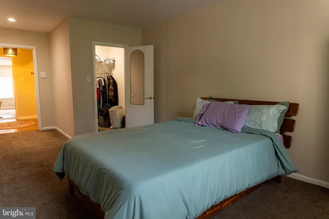 a view of a building with a bench in patio