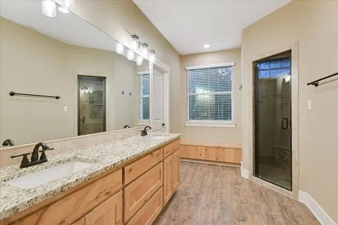 a bathroom with a granite countertop sink mirror and double