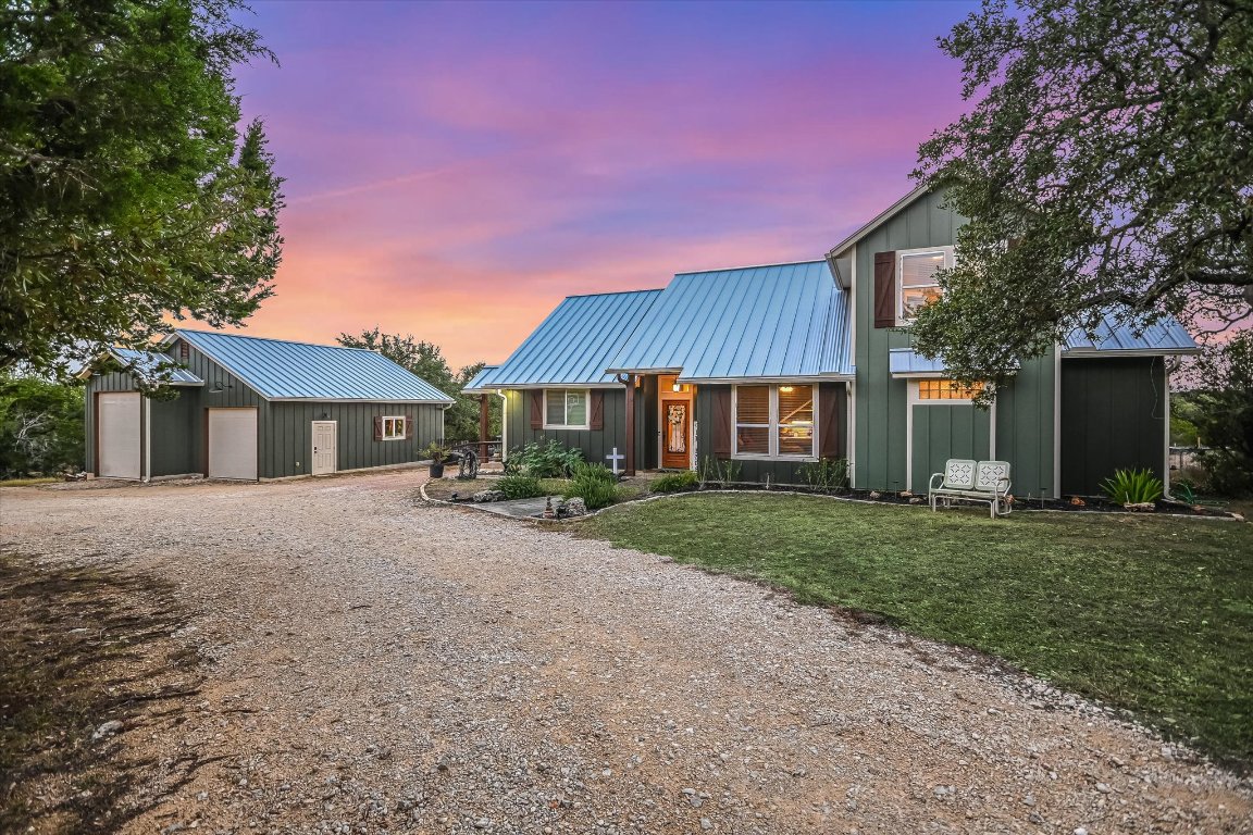 8305 Ozark Drive San Marcos, TX 78666 - Photo 2 of 34 a front view of a house with a yard and trees
