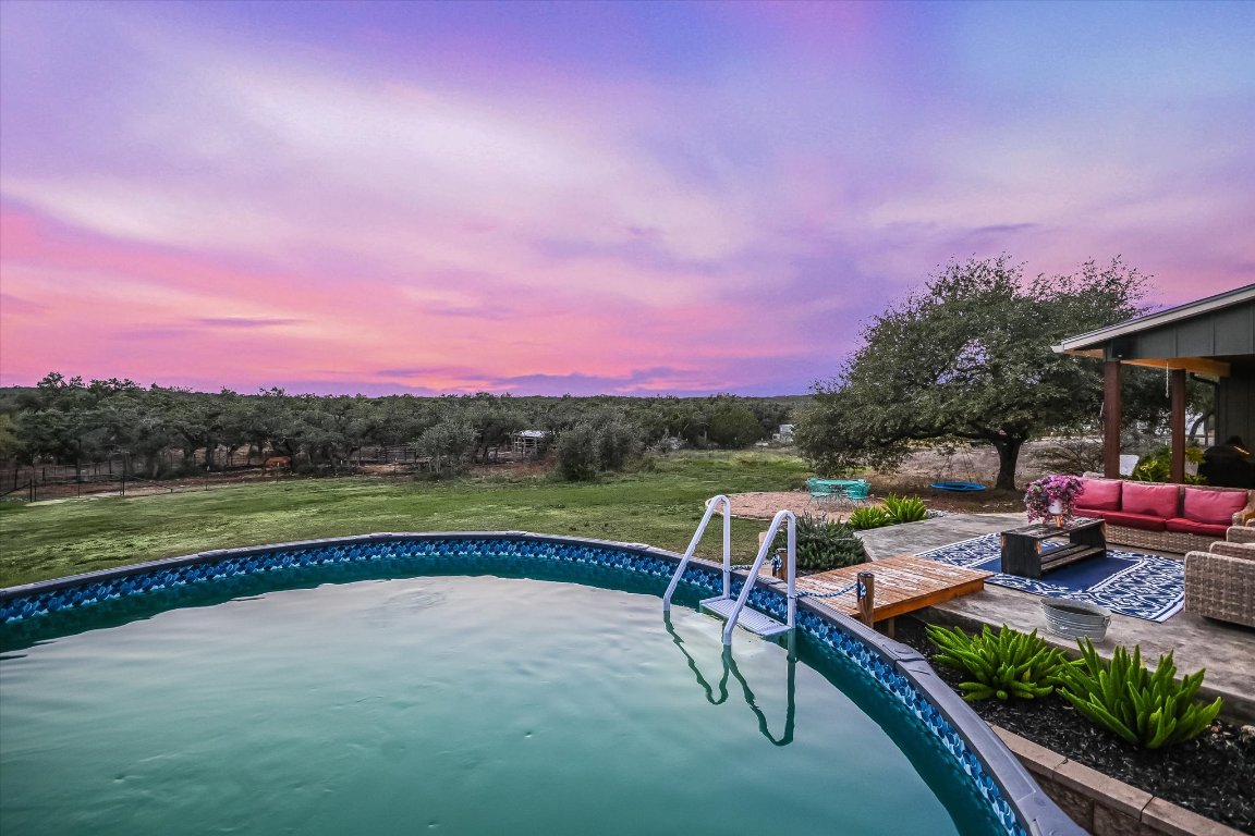8305 Ozark Drive San Marcos, TX 78666 - Photo 23 of 34 a view of swimming pool with a table and chairs