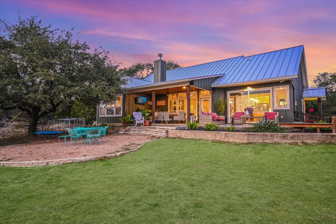 8305 Ozark Drive San Marcos, TX 78666 - Photo 24 of 34 a view of swimming pool with outdoor seating and a garden