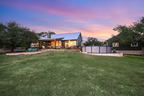 a view of a house with a back yard