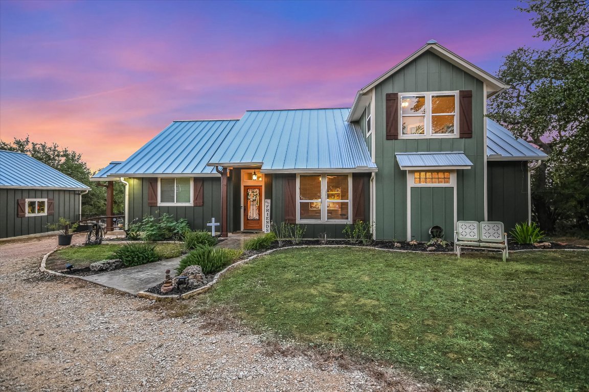 8305 Ozark Drive San Marcos, TX 78666 - Photo 3 of 34 a front view of a house with garden