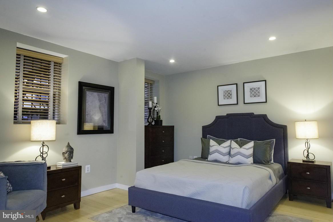 1632 S Street Northwest, Unit 1 Washington, DC 20009 - Photo 8 of 11 a bedroom with a bed and a lamp