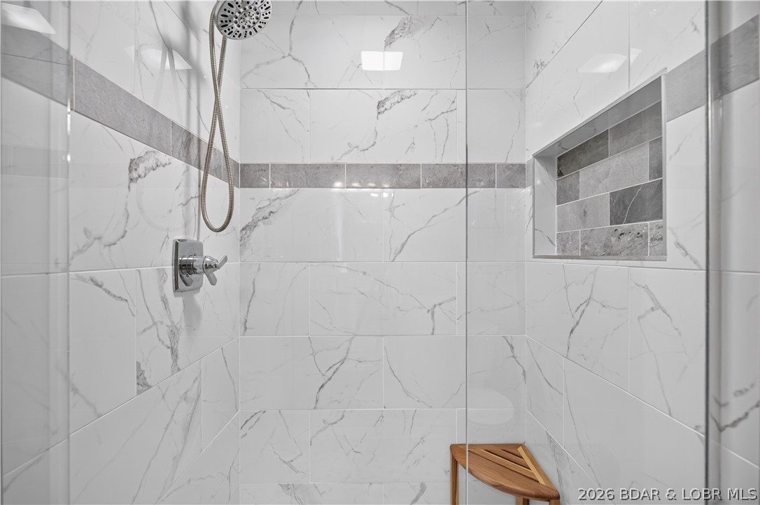 73 Evergreen Road, Unit 3A Sunrise Beach, MO 65079 - Photo 53 of 89 Spa like shower for guests in bedroom #2.