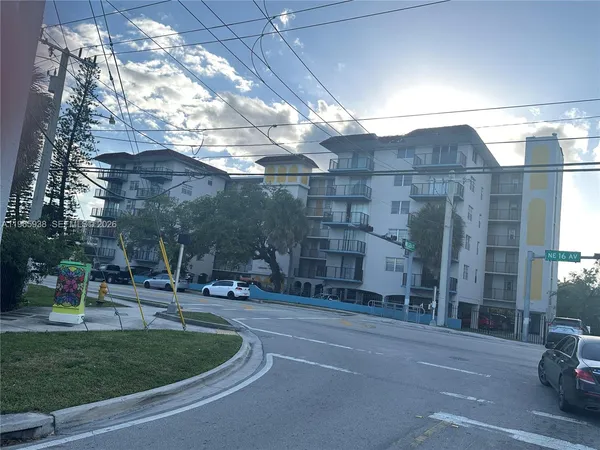 a view of a building with a yard