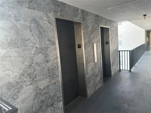 a front view of a building with street view