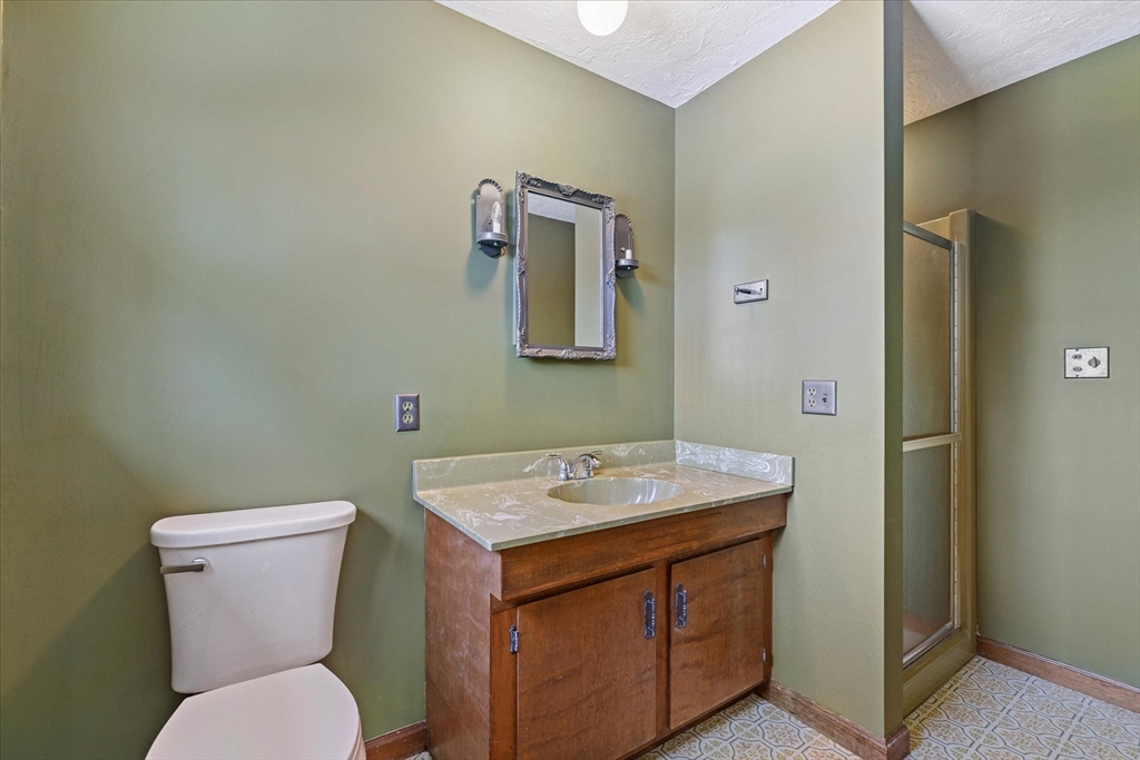100 Asnebumskit Road Paxton, MA 01612 - Photo 21 of 42 a bathroom with a toilet sink and mirror