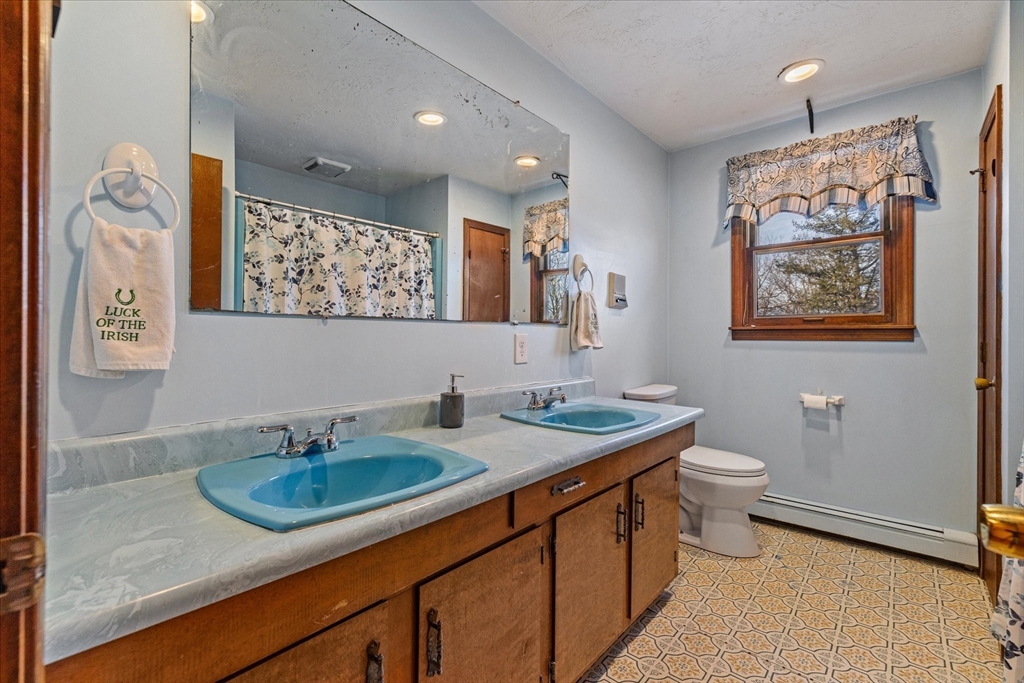 100 Asnebumskit Road Paxton, MA 01612 - Photo 24 of 42 a bathroom with a toilet sink and mirror