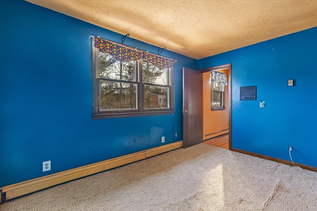 100 Asnebumskit Road Paxton, MA 01612 - Photo 26 of 42 a view of empty room with windows