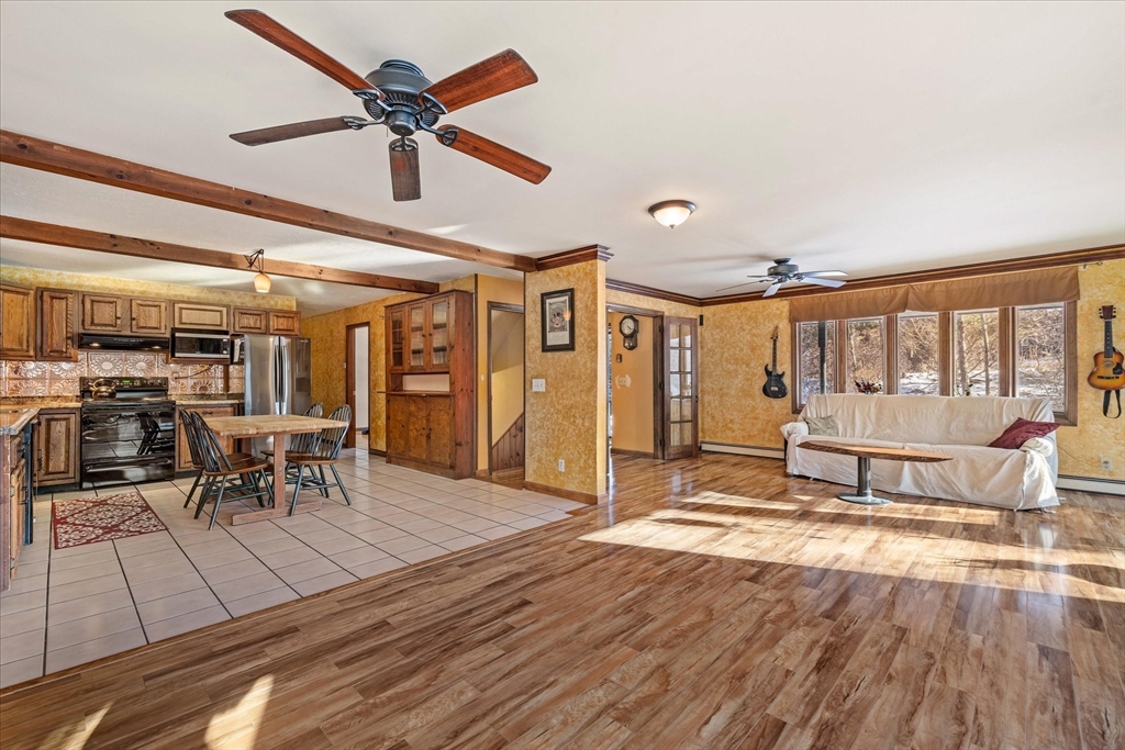 100 Asnebumskit Road Paxton, MA 01612 - Photo 3 of 42 a living room with furniture a wooden floor and chandelier