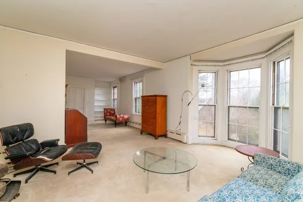 a room with furniture and gym equipment