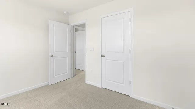 an empty room with closet area
