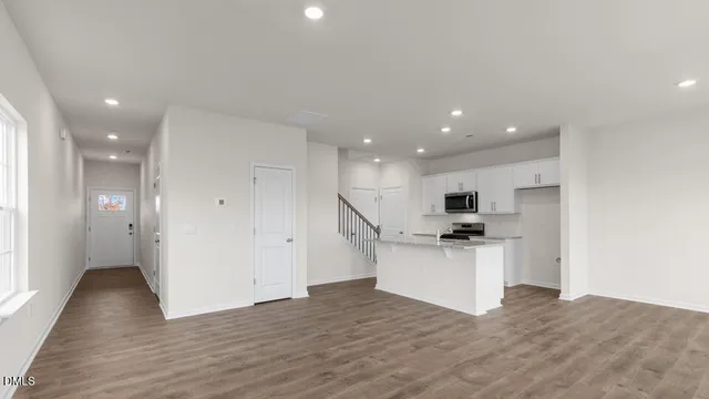 a kitchen with a sink and a refrigerator