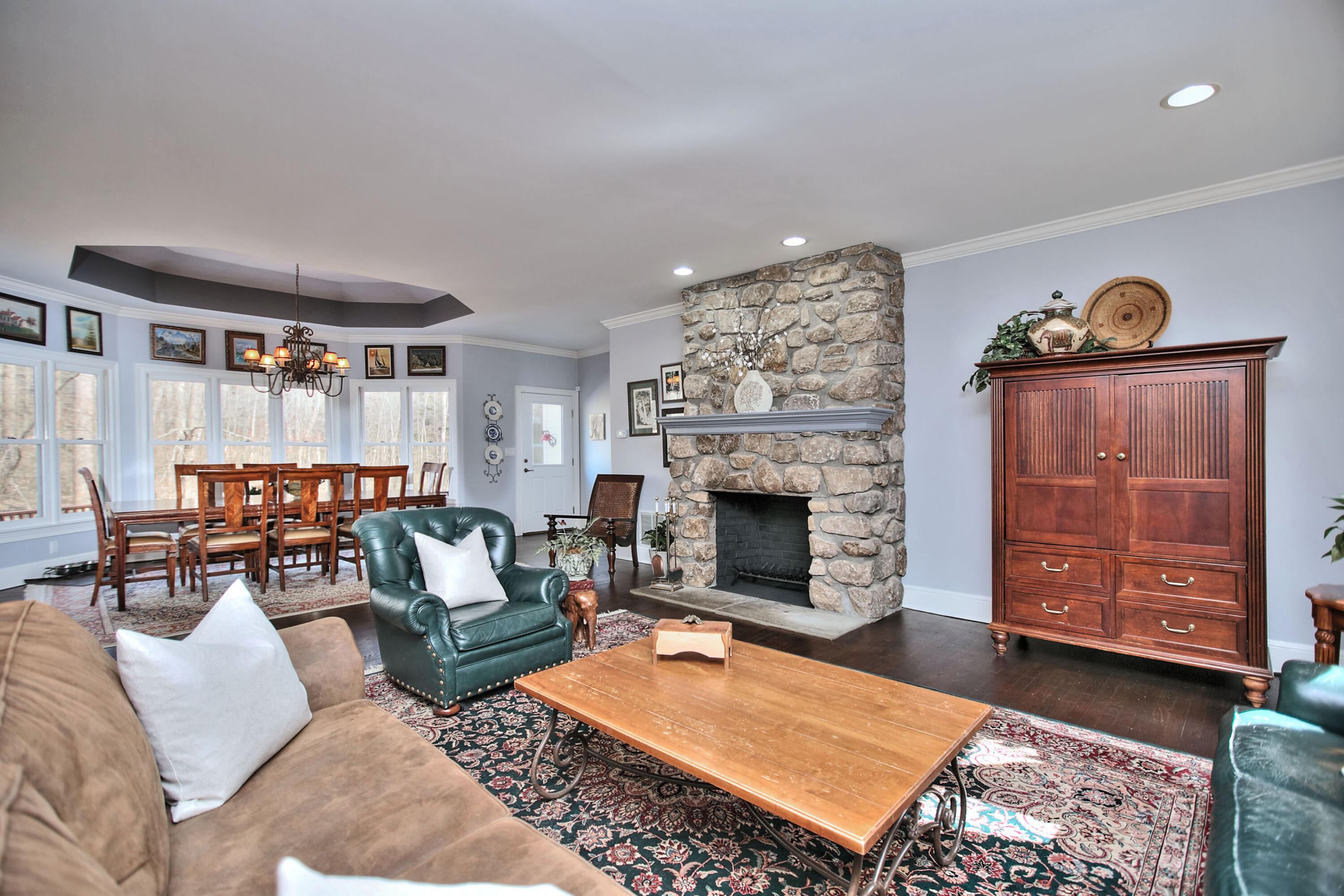 191 Smith Ridge Road New Canaan, CT 06840 - Photo 11 of 42 a living room with furniture a rug and a fireplace