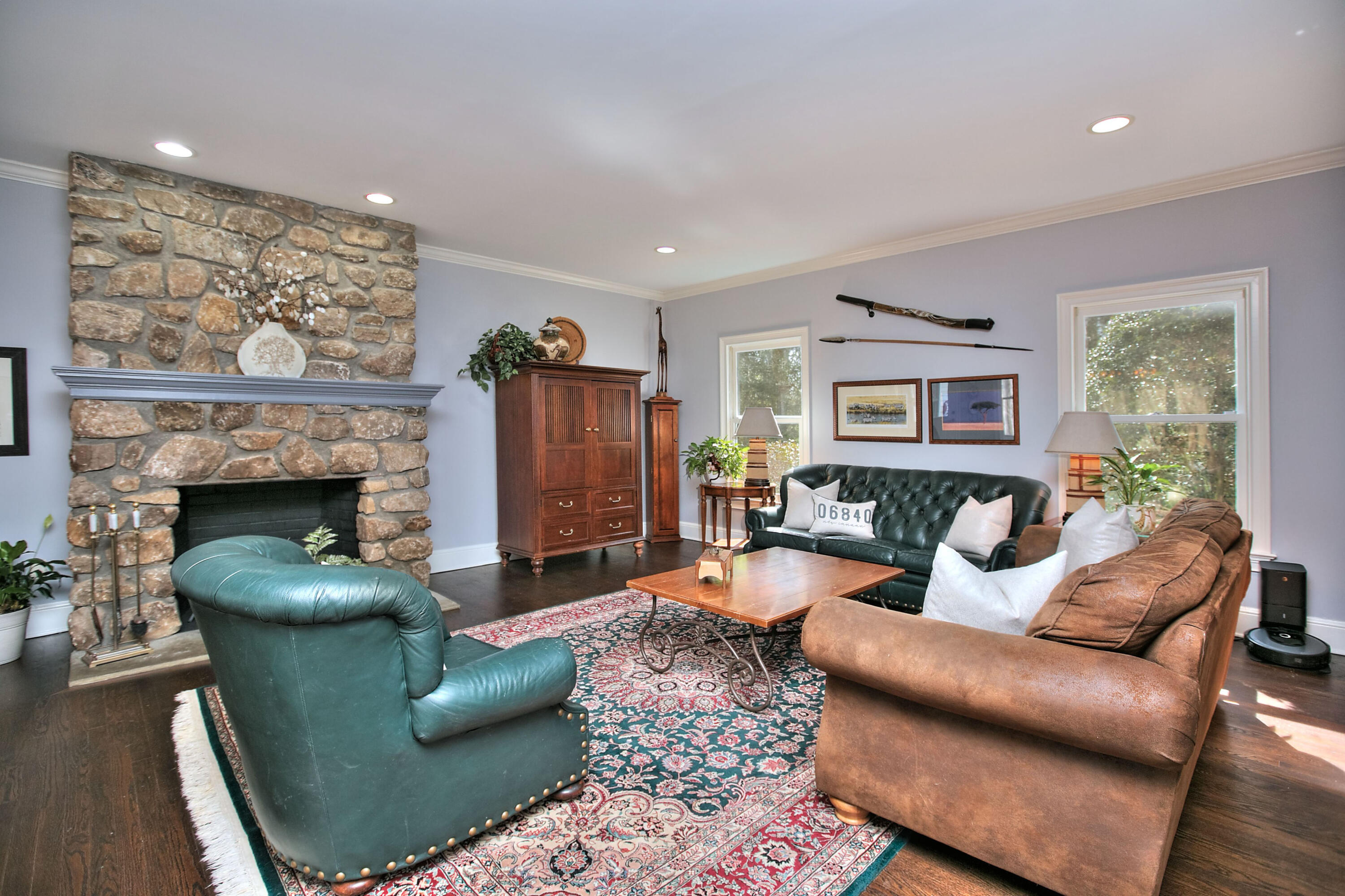 191 Smith Ridge Road New Canaan, CT 06840 - Photo 12 of 42 a living room with furniture a flat screen tv and a fireplace