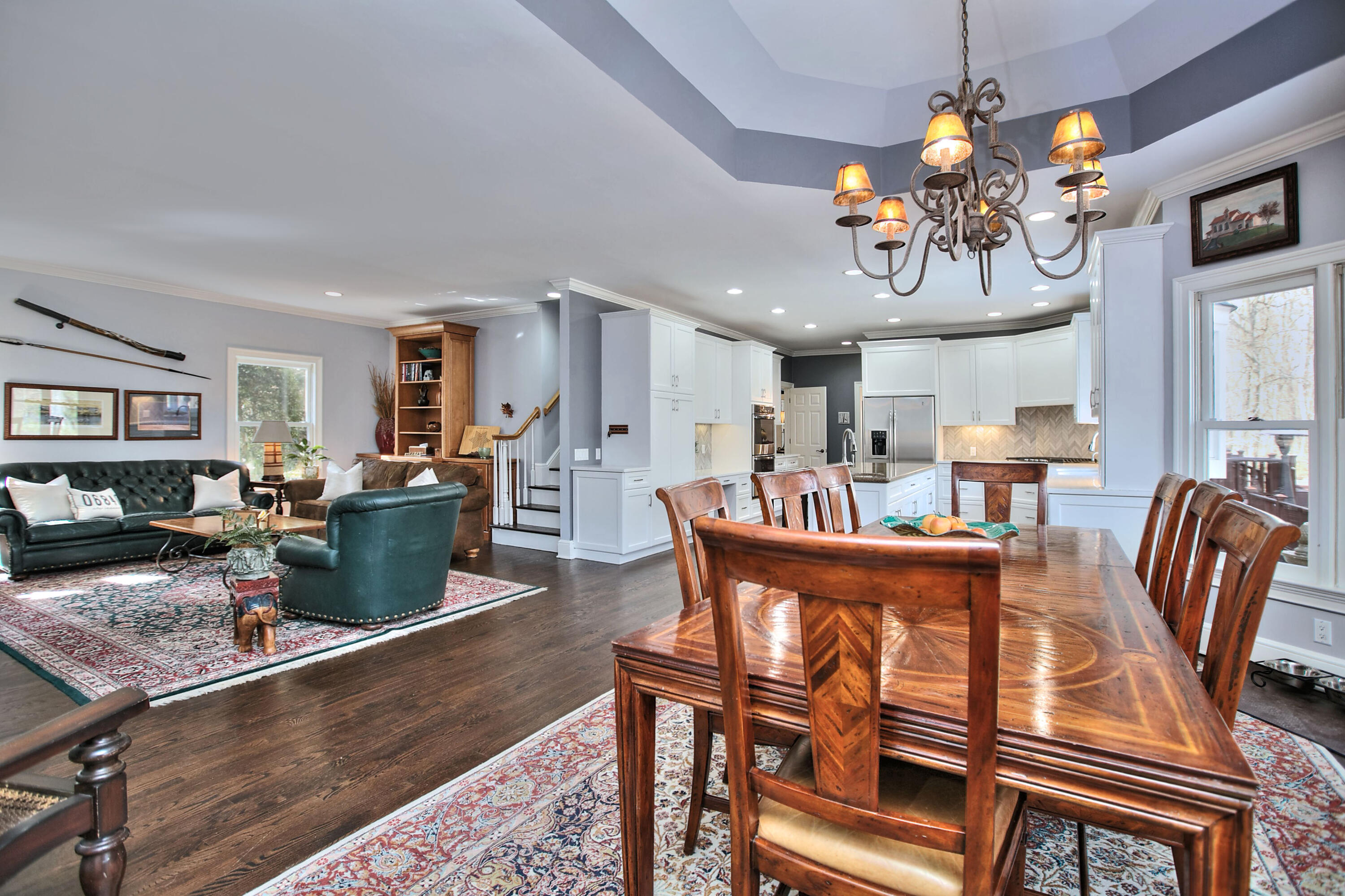 191 Smith Ridge Road New Canaan, CT 06840 - Photo 13 of 42 a view of a dining room with furniture a rug and wooden floor