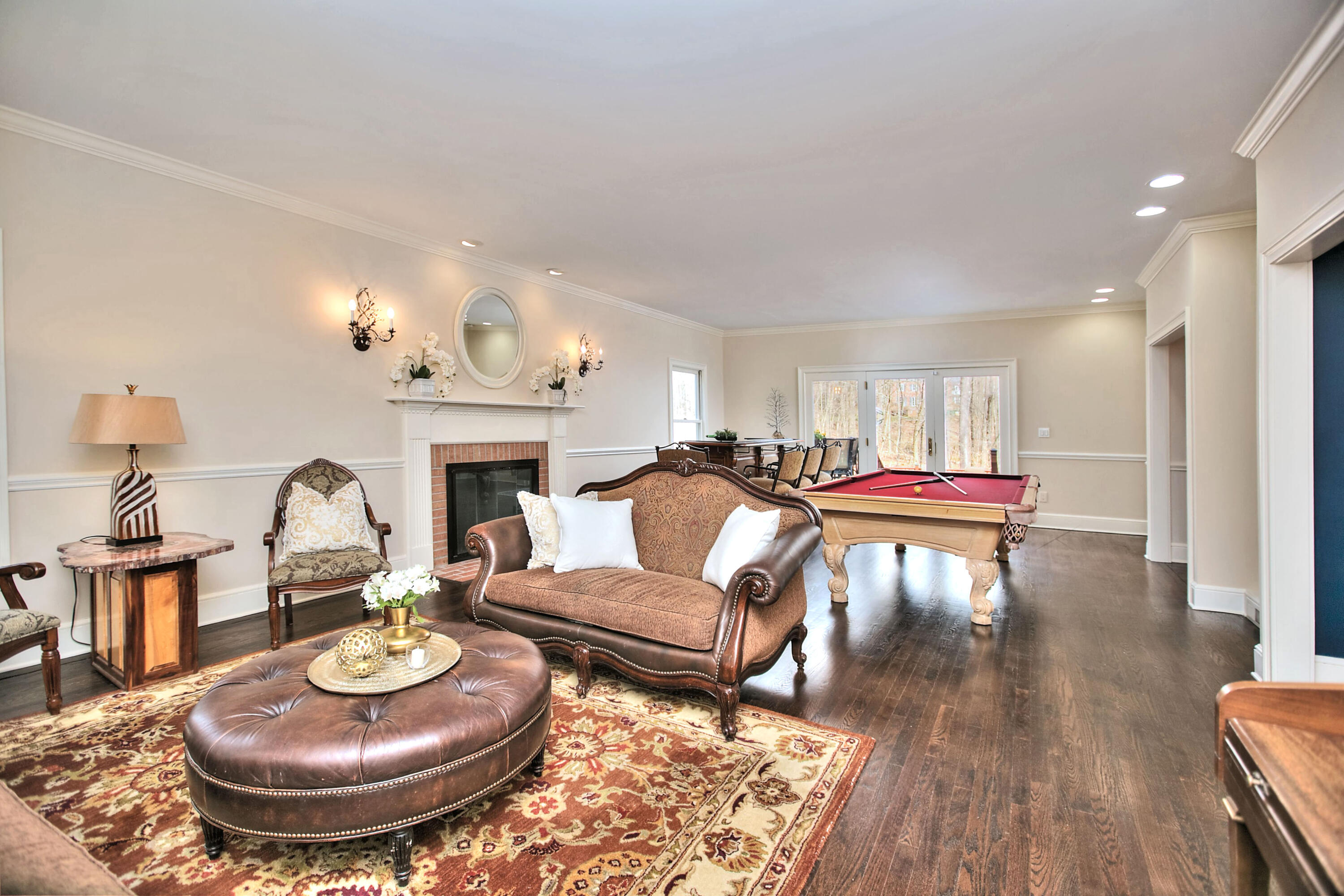 191 Smith Ridge Road New Canaan, CT 06840 - Photo 14 of 42 a living room with furniture and a fireplace