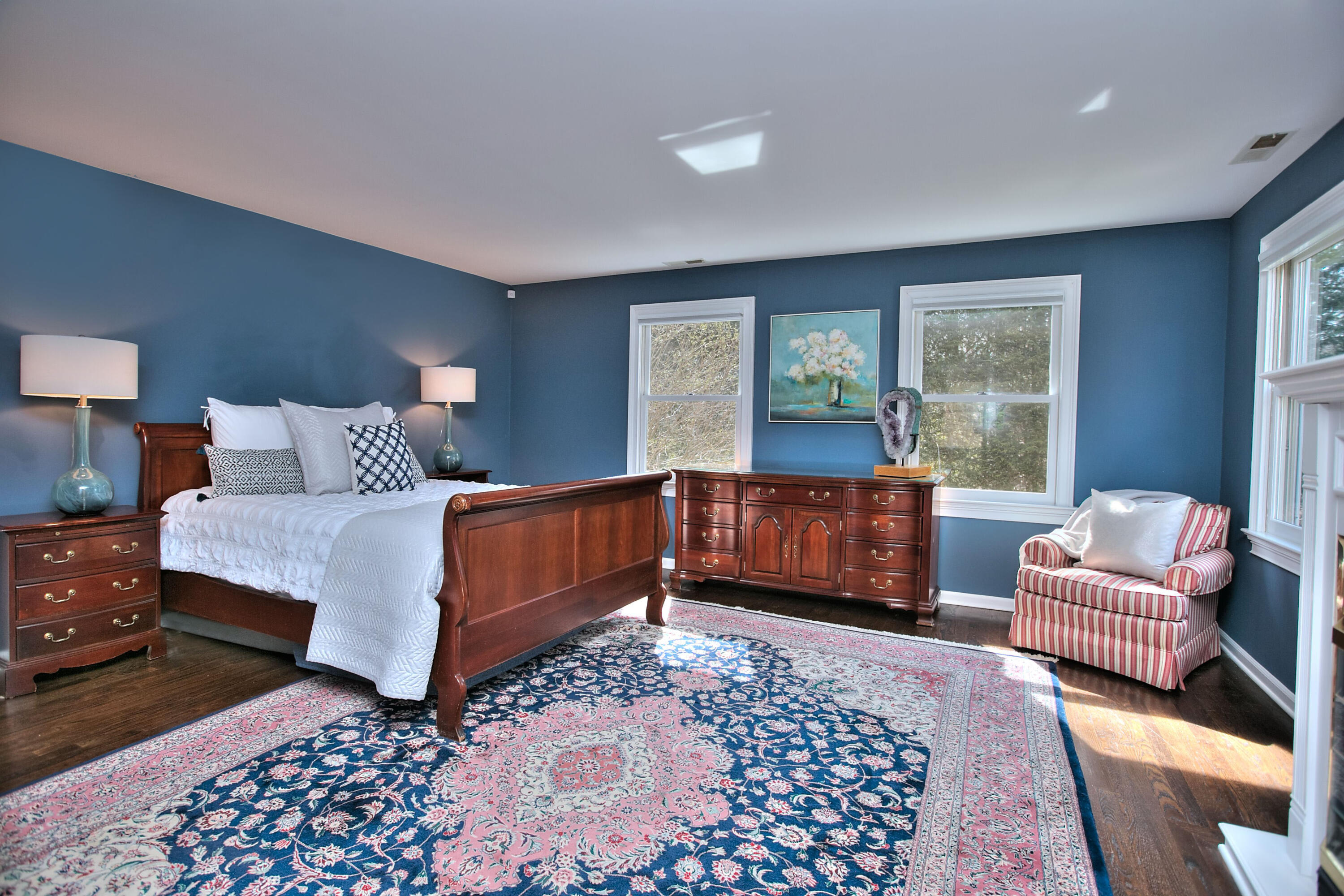 191 Smith Ridge Road New Canaan, CT 06840 - Photo 20 of 42 a bedroom with a bed and a couch