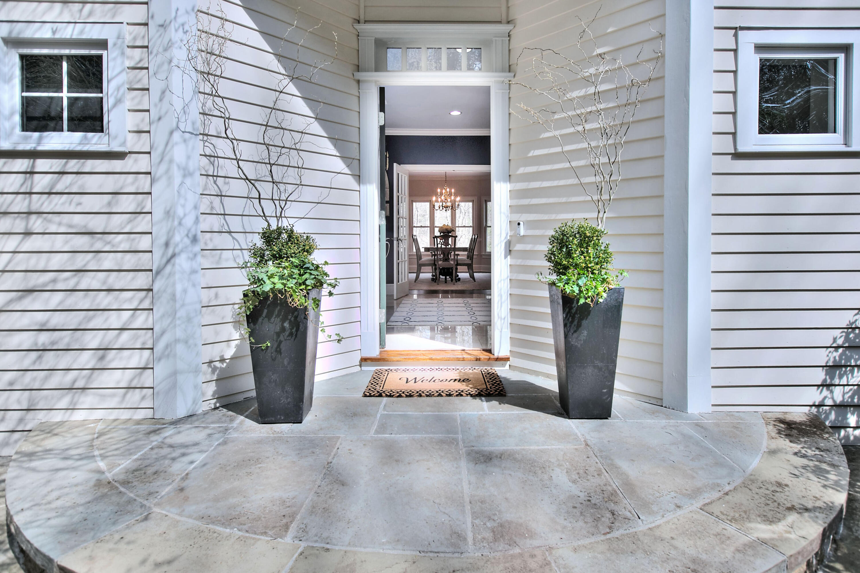 191 Smith Ridge Road New Canaan, CT 06840 - Photo 2 of 42 a view of a entryway door front of house