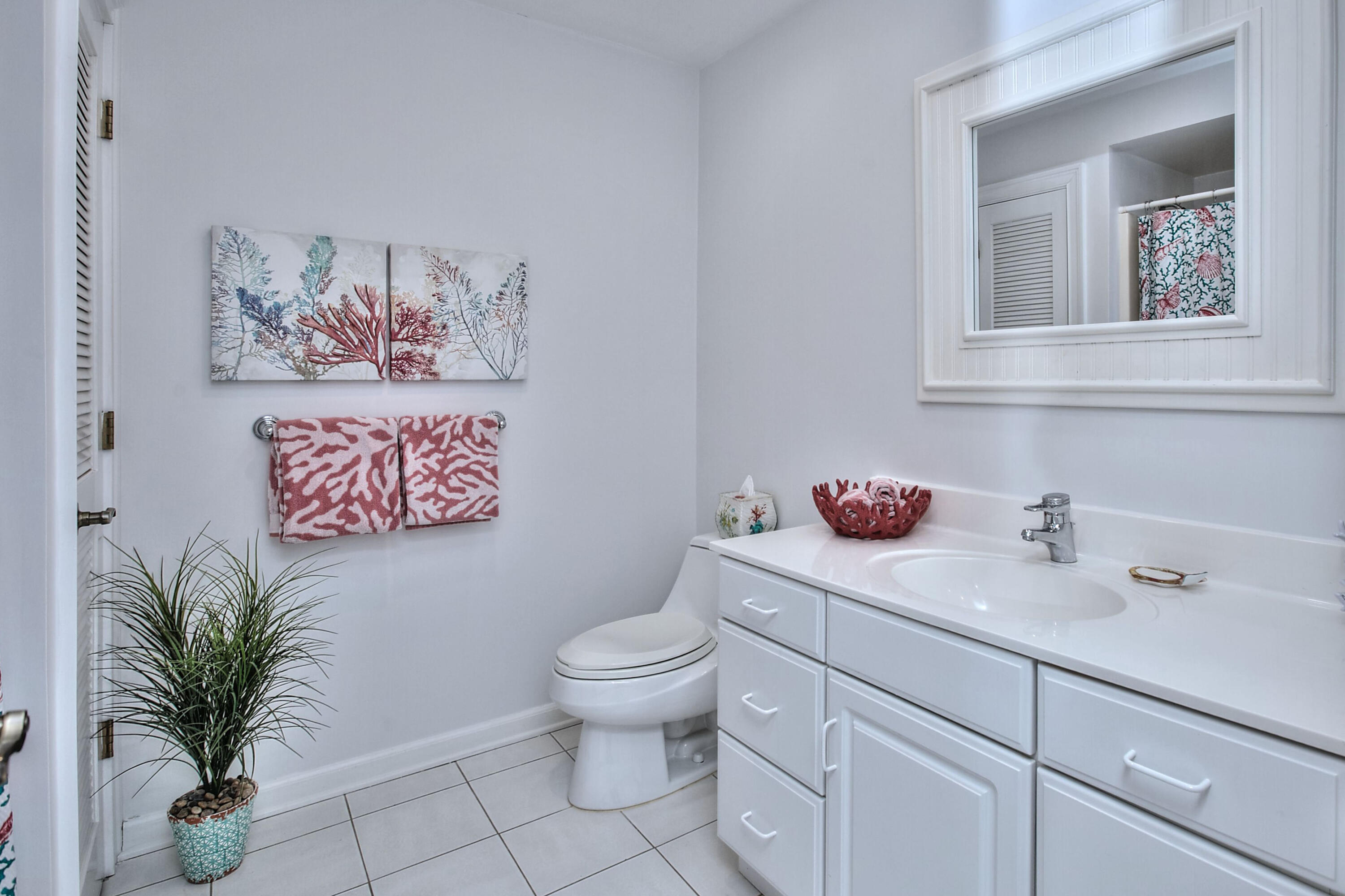 191 Smith Ridge Road New Canaan, CT 06840 - Photo 24 of 42 a bathroom with a toilet sink and mirror