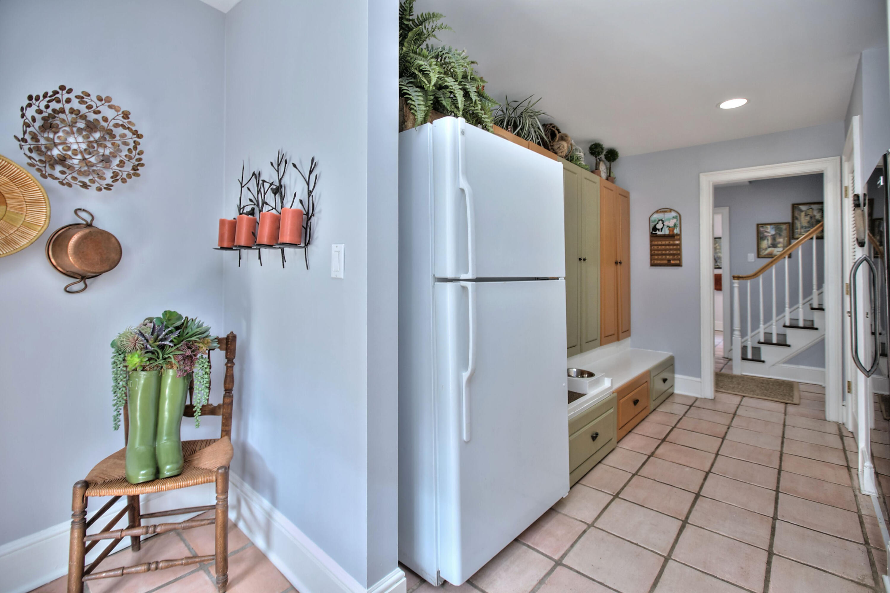 191 Smith Ridge Road New Canaan, CT 06840 - Photo 32 of 42 a white refrigerator freezer sitting in a kitchen