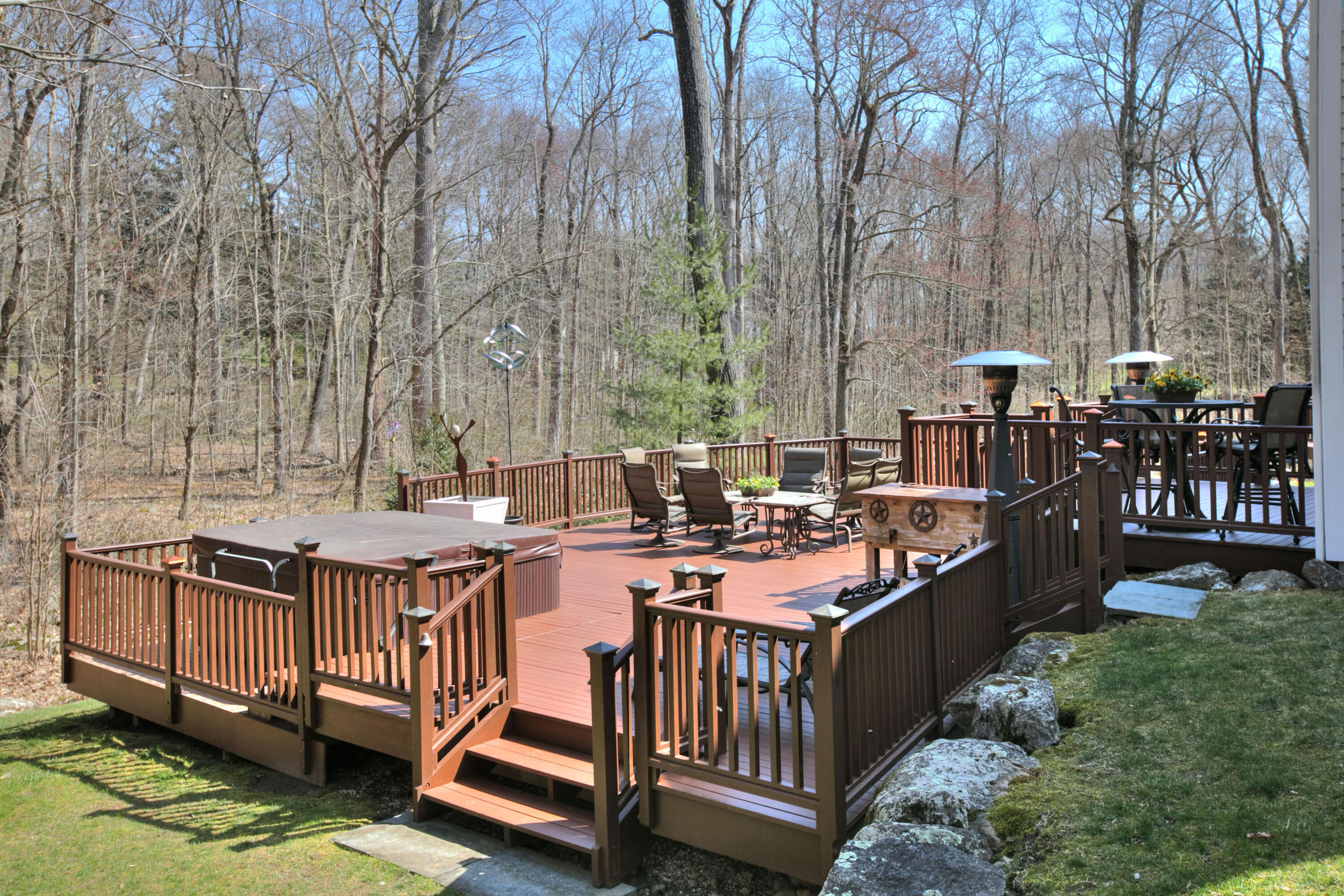 191 Smith Ridge Road New Canaan, CT 06840 - Photo 33 of 42 a view of a chairs and table in the backyard
