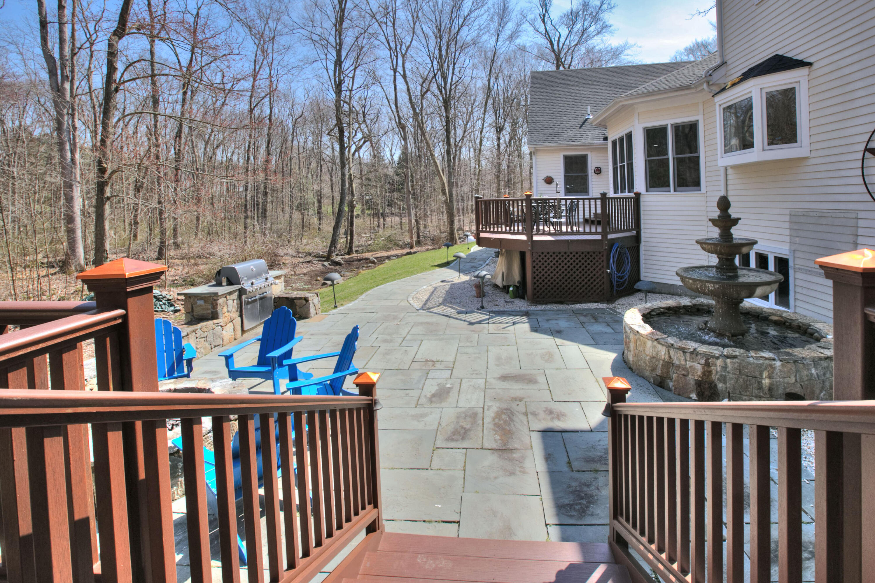 191 Smith Ridge Road New Canaan, CT 06840 - Photo 37 of 42 a view of a chairs and tables in the back yard of the house