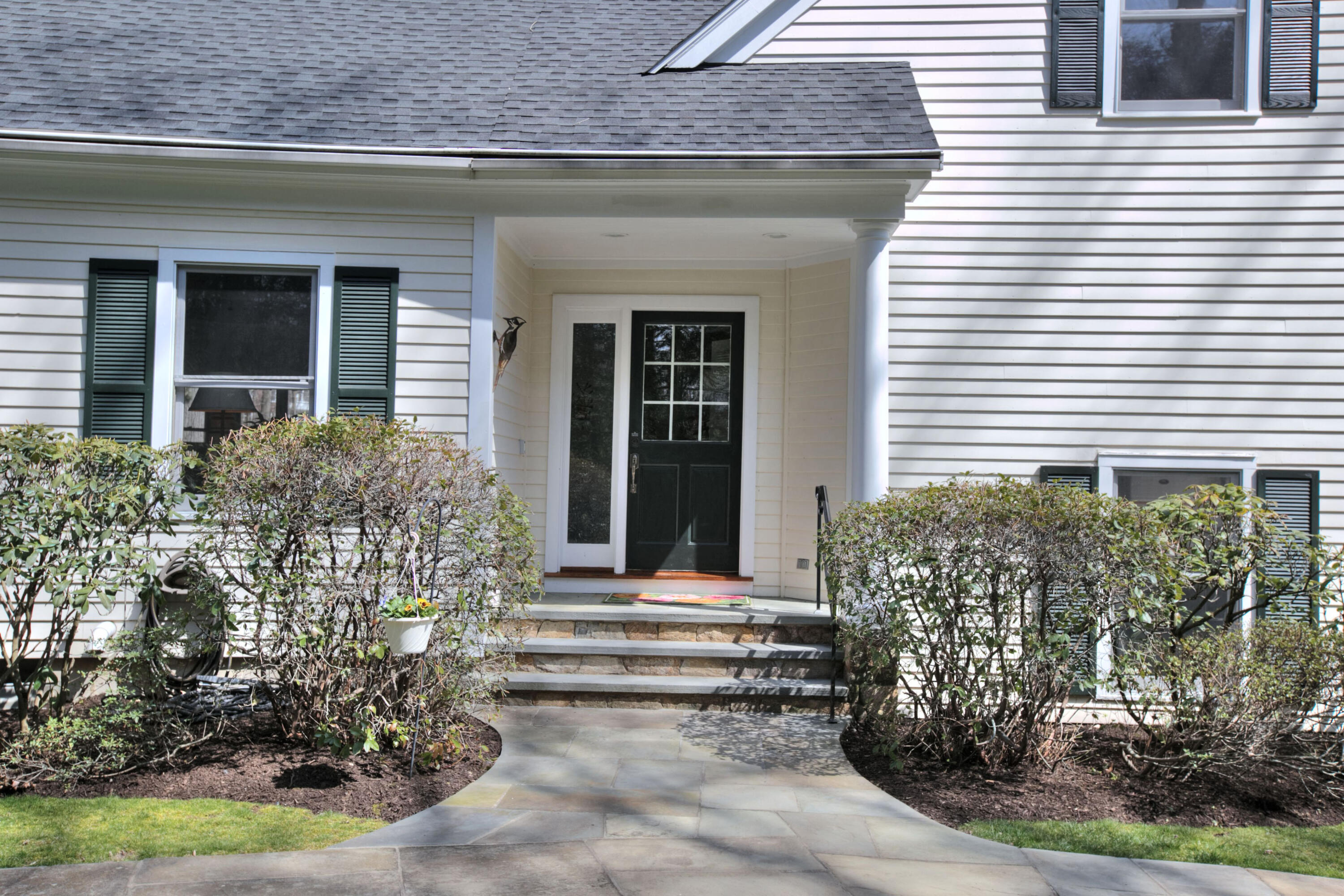 191 Smith Ridge Road New Canaan, CT 06840 - Photo 41 of 42 a front view of a house with garden