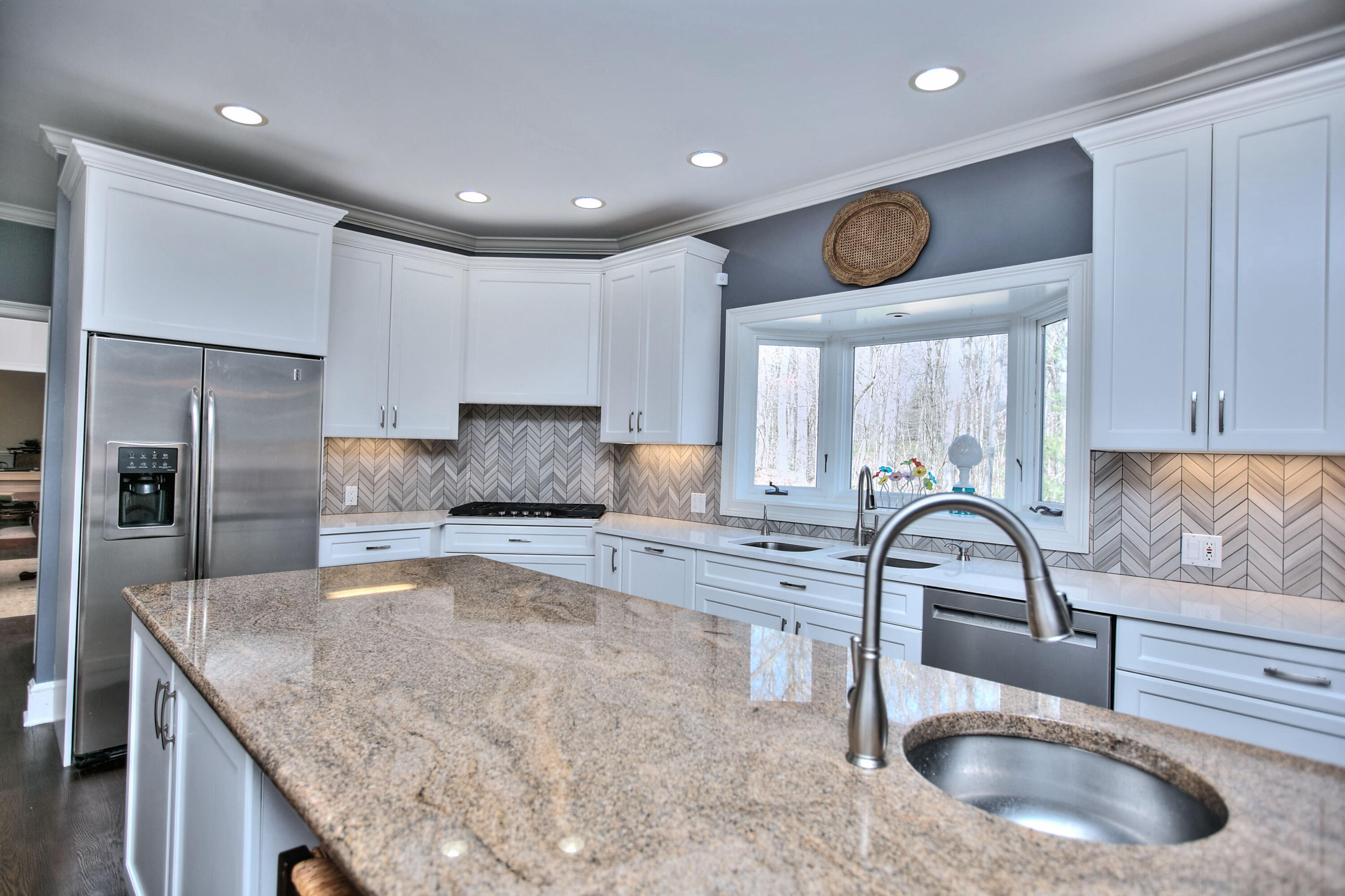 191 Smith Ridge Road New Canaan, CT 06840 - Photo 8 of 42 a kitchen with stainless steel appliances granite countertop a sink a refrigerator and a wooden cabinets