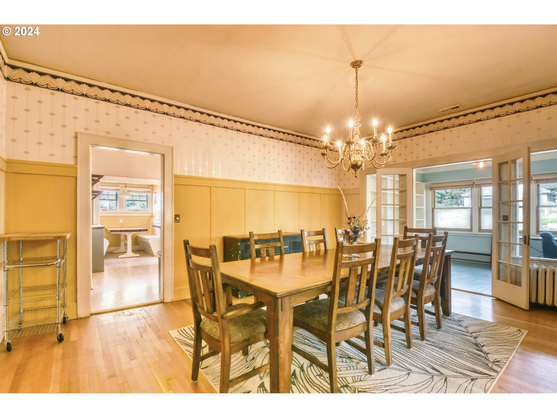 421 North Main Street Pendleton, OR 97801 - Photo 11 of 48 a dining room with furniture a chandelier and wooden floor