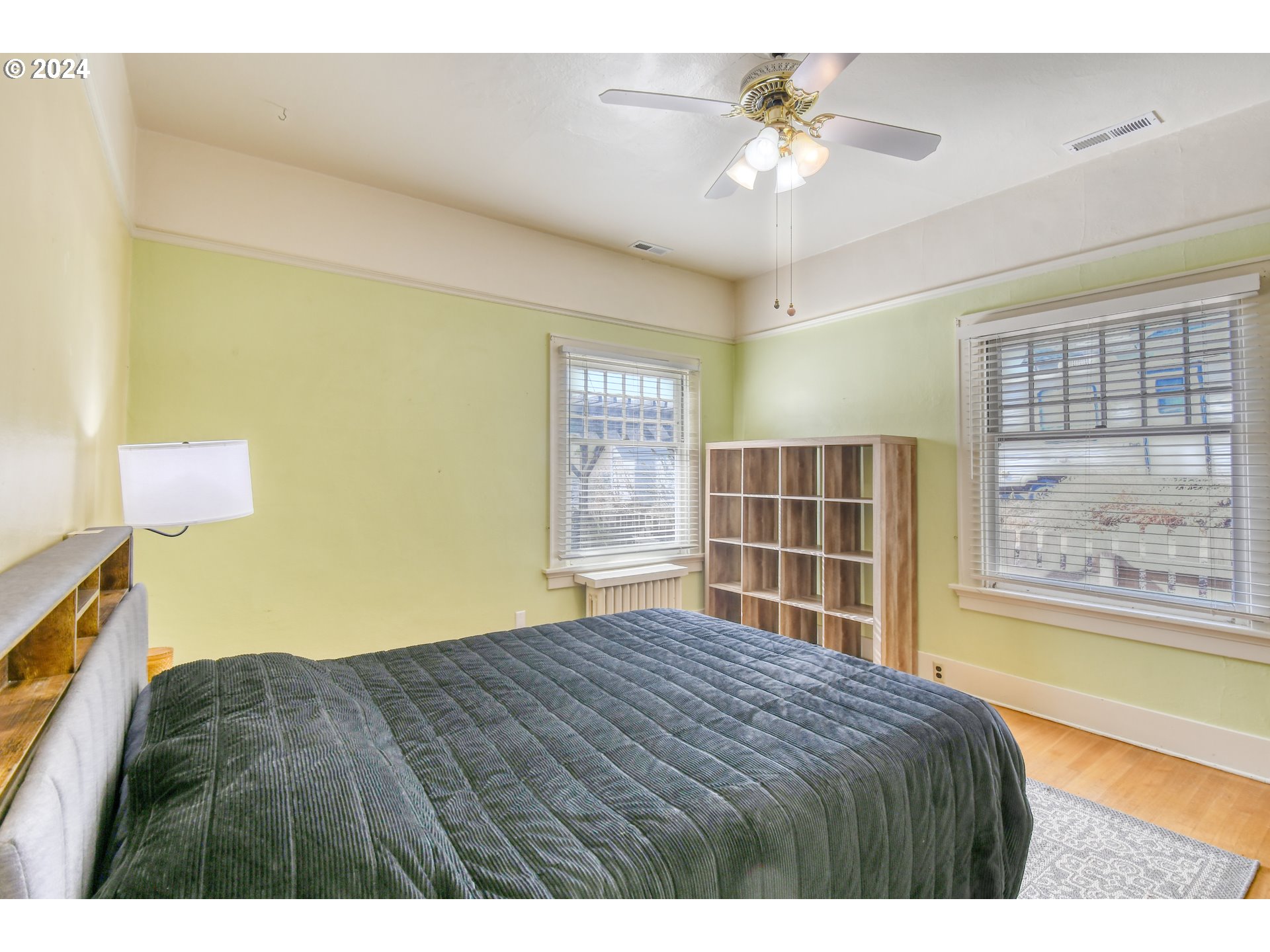 421 North Main Street Pendleton, OR 97801 - Photo 24 of 48 a bedroom with a large bed and a chandelier