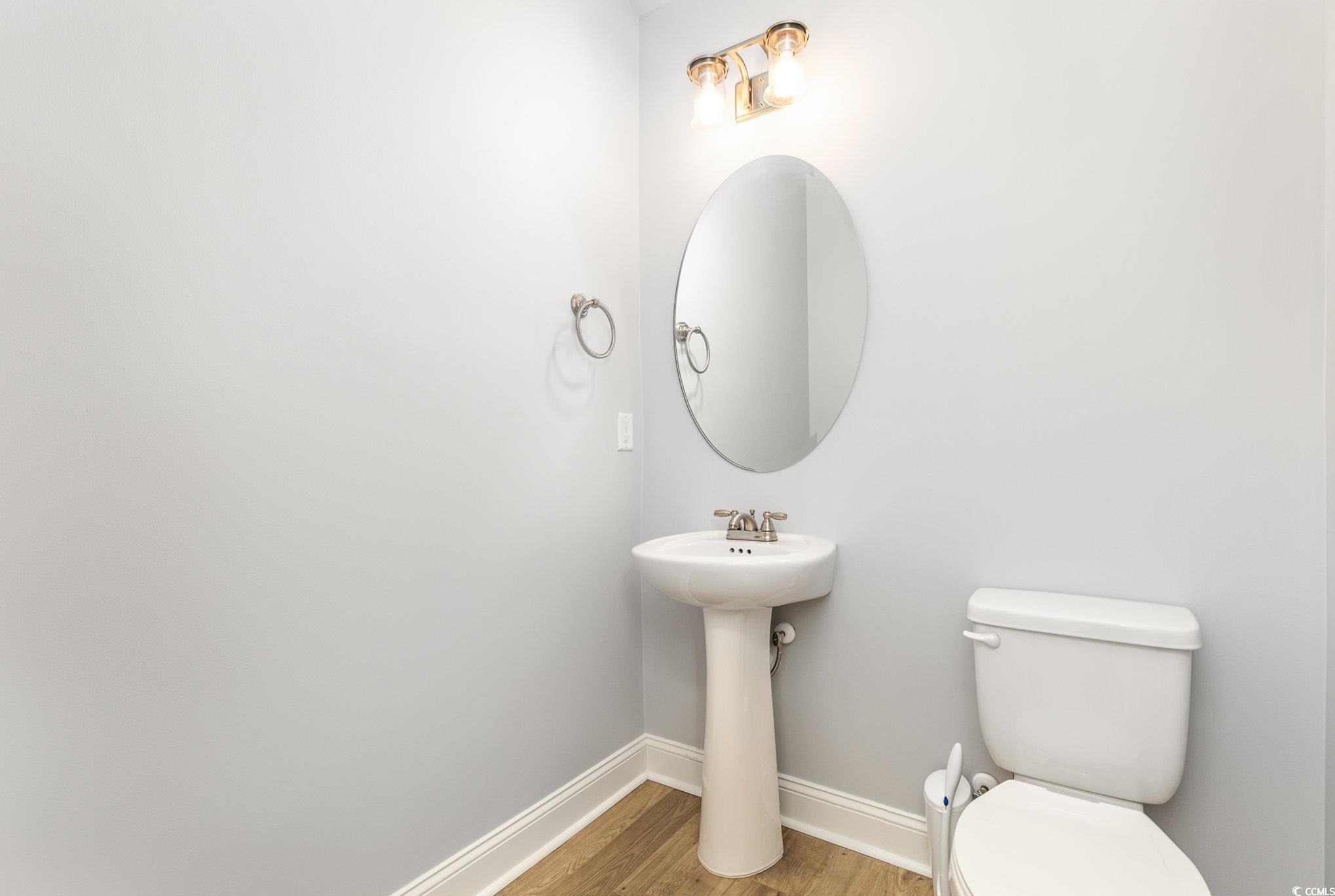 1438 Perch Place Longs, SC 29568 - Photo 12 of 39 Bathroom with toilet and hardwood / wood-style flo
