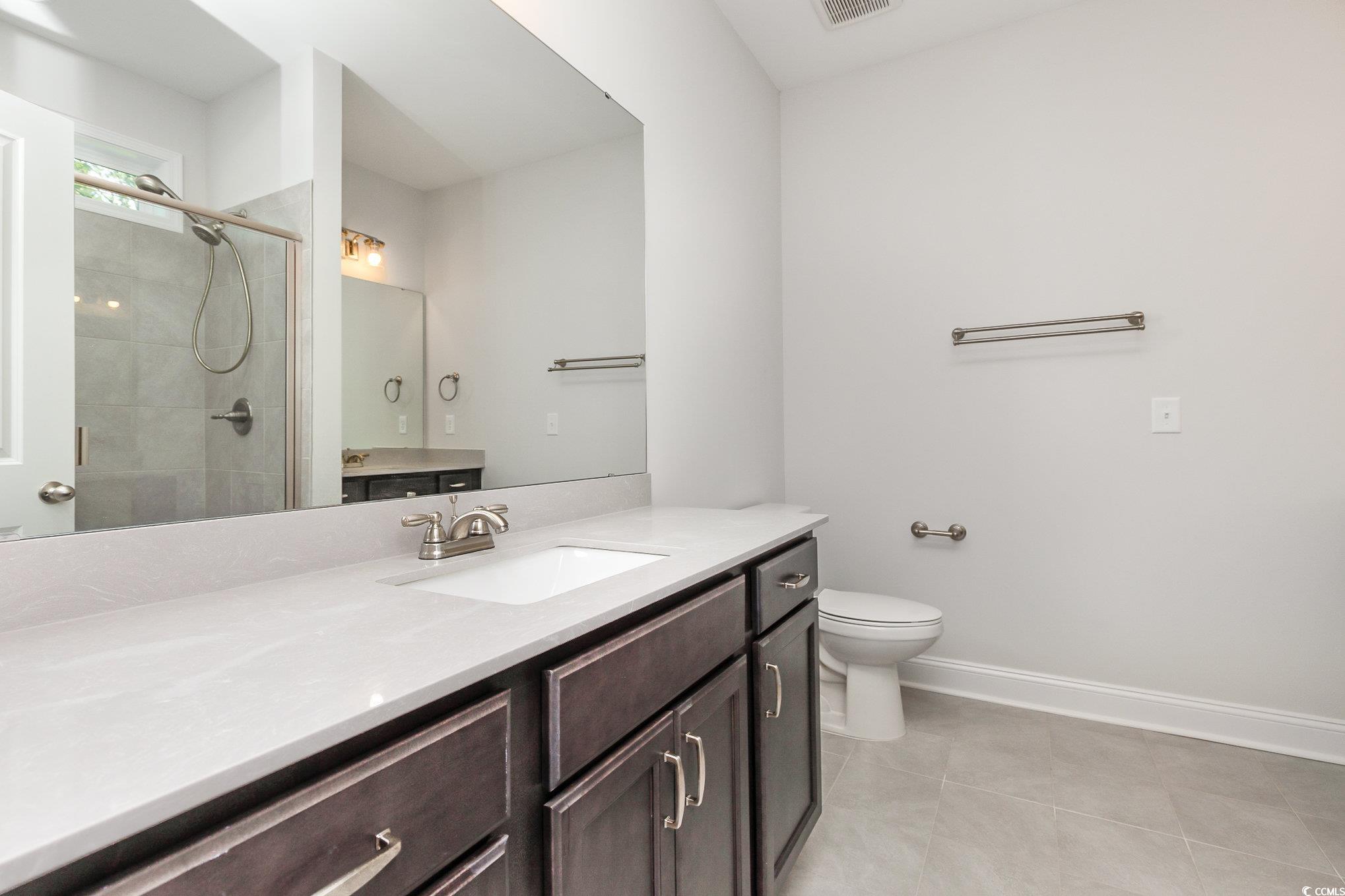 1438 Perch Place Longs, SC 29568 - Photo 17 of 39 Bathroom with vanity, an enclosed shower, tile pat