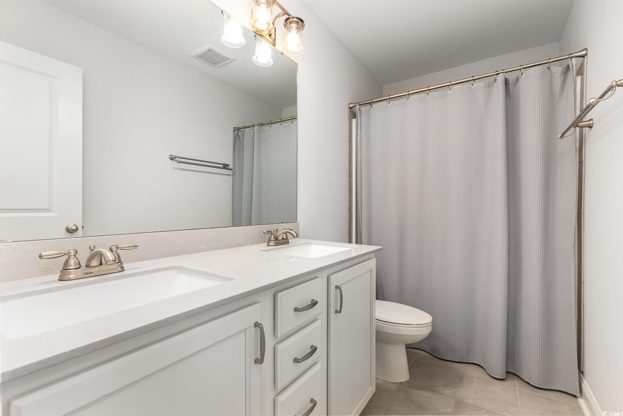 1438 Perch Place Longs, SC 29568 - Photo 24 of 39 Bathroom with tile patterned floors, toilet, and d