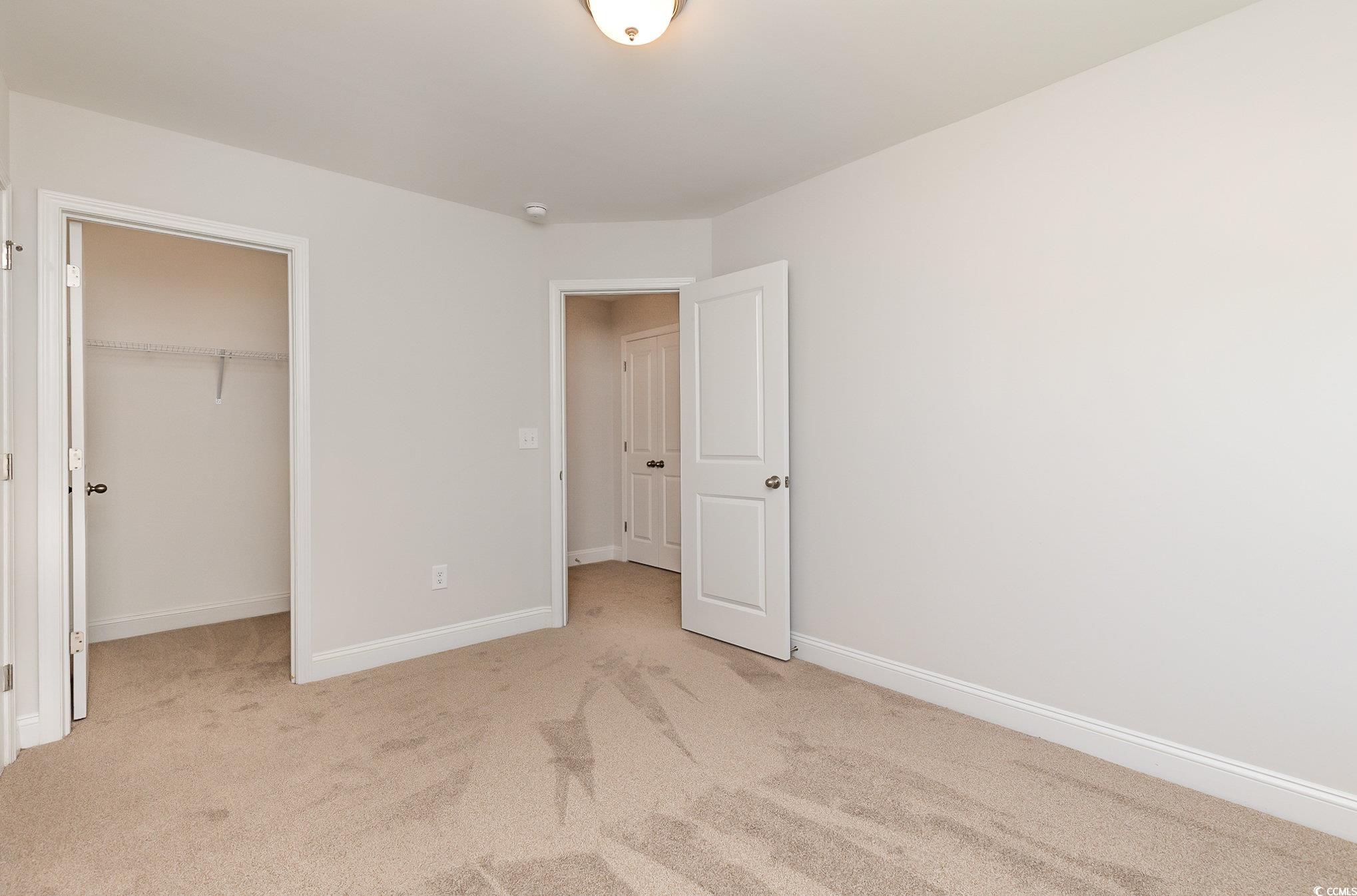 1438 Perch Place Longs, SC 29568 - Photo 26 of 39 Unfurnished bedroom featuring a closet, carpet flo