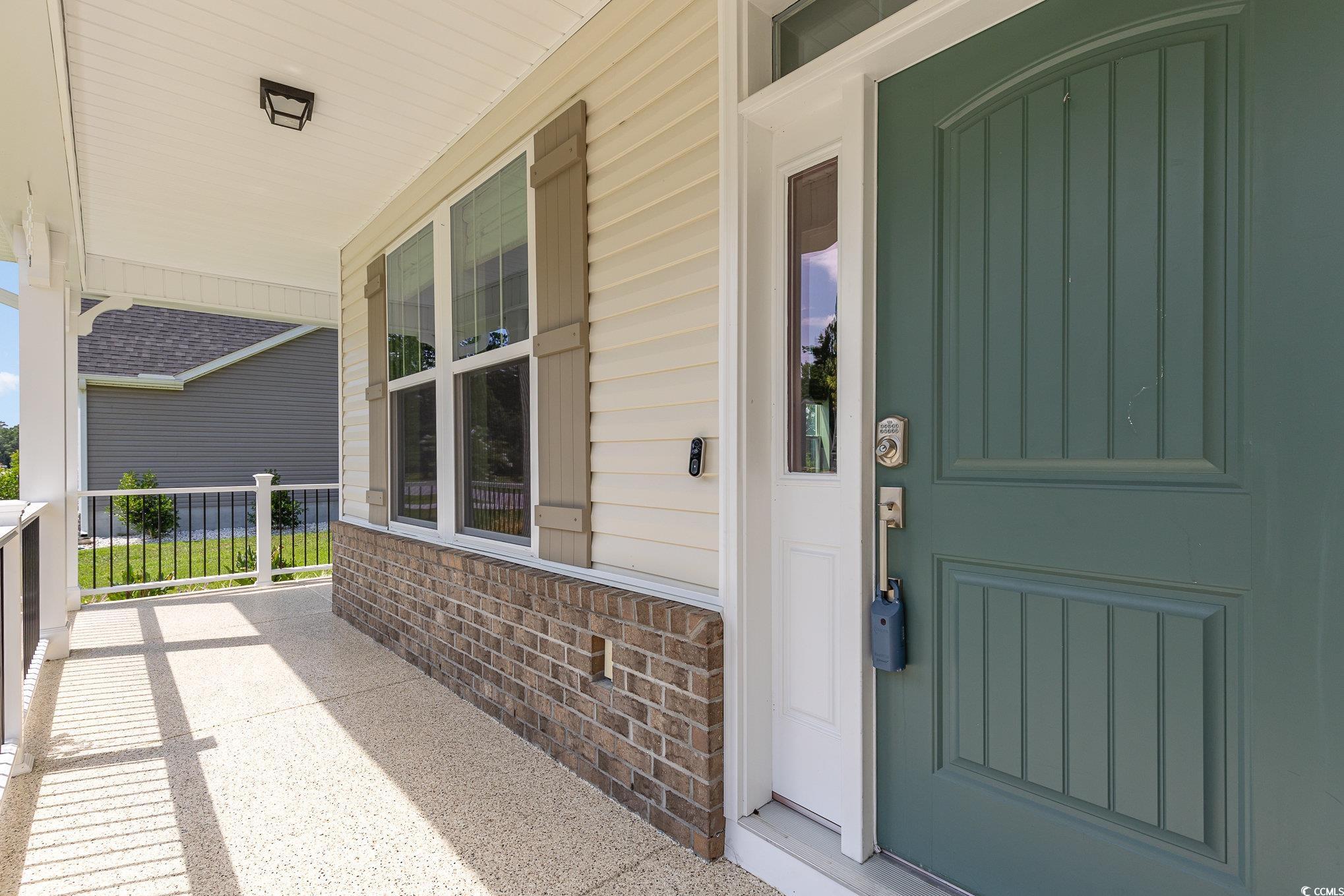 1438 Perch Place Longs, SC 29568 - Photo 3 of 39 View of exterior entry featuring covered porch