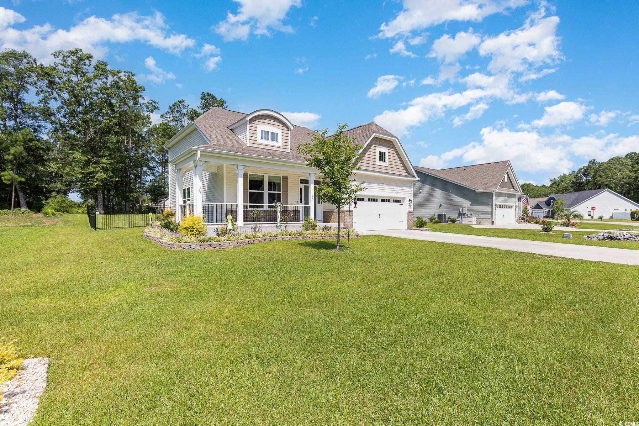 1438 Perch Place Longs, SC 29568 - Photo 37 of 39 View of front facade featuring covered porch and a