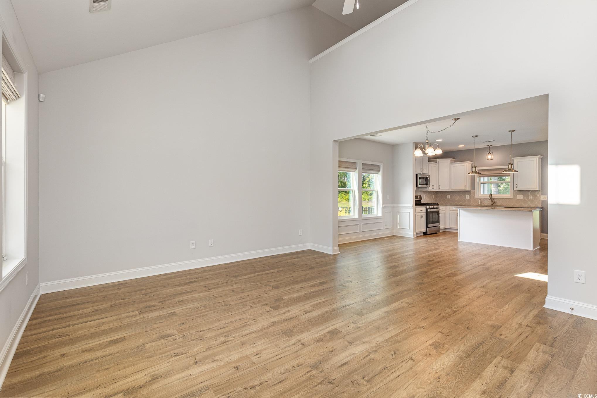 1438 Perch Place Longs, SC 29568 - Photo 4 of 39 Unfurnished living room featuring a notable chande