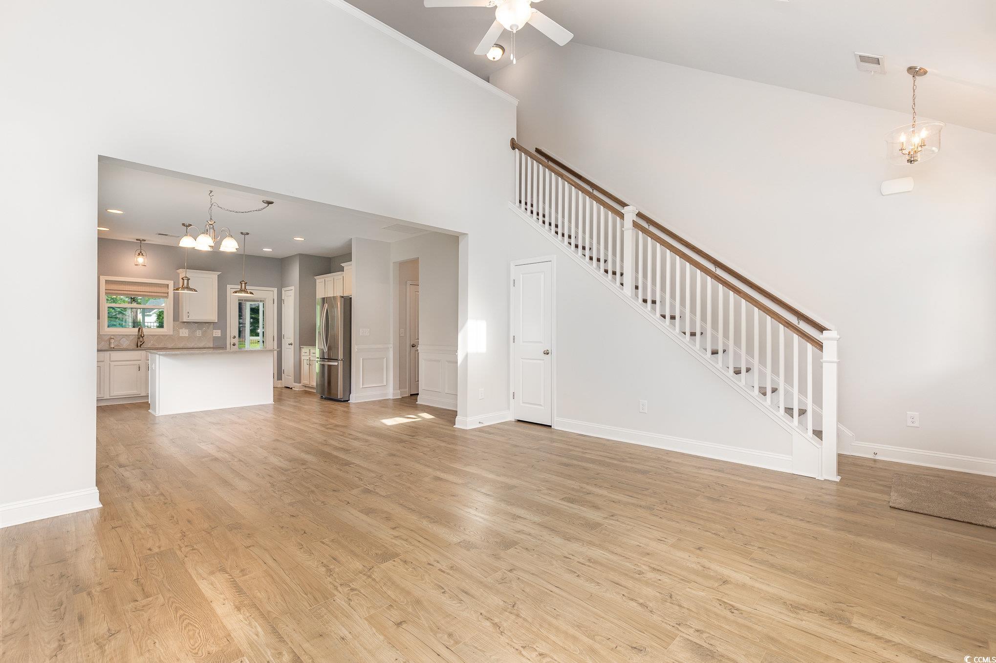 1438 Perch Place Longs, SC 29568 - Photo 5 of 39 Unfurnished living room featuring sink, high vault
