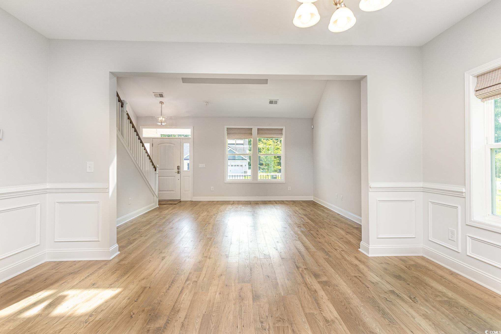 1438 Perch Place Longs, SC 29568 - Photo 6 of 39 Spare room featuring a notable chandelier and ligh