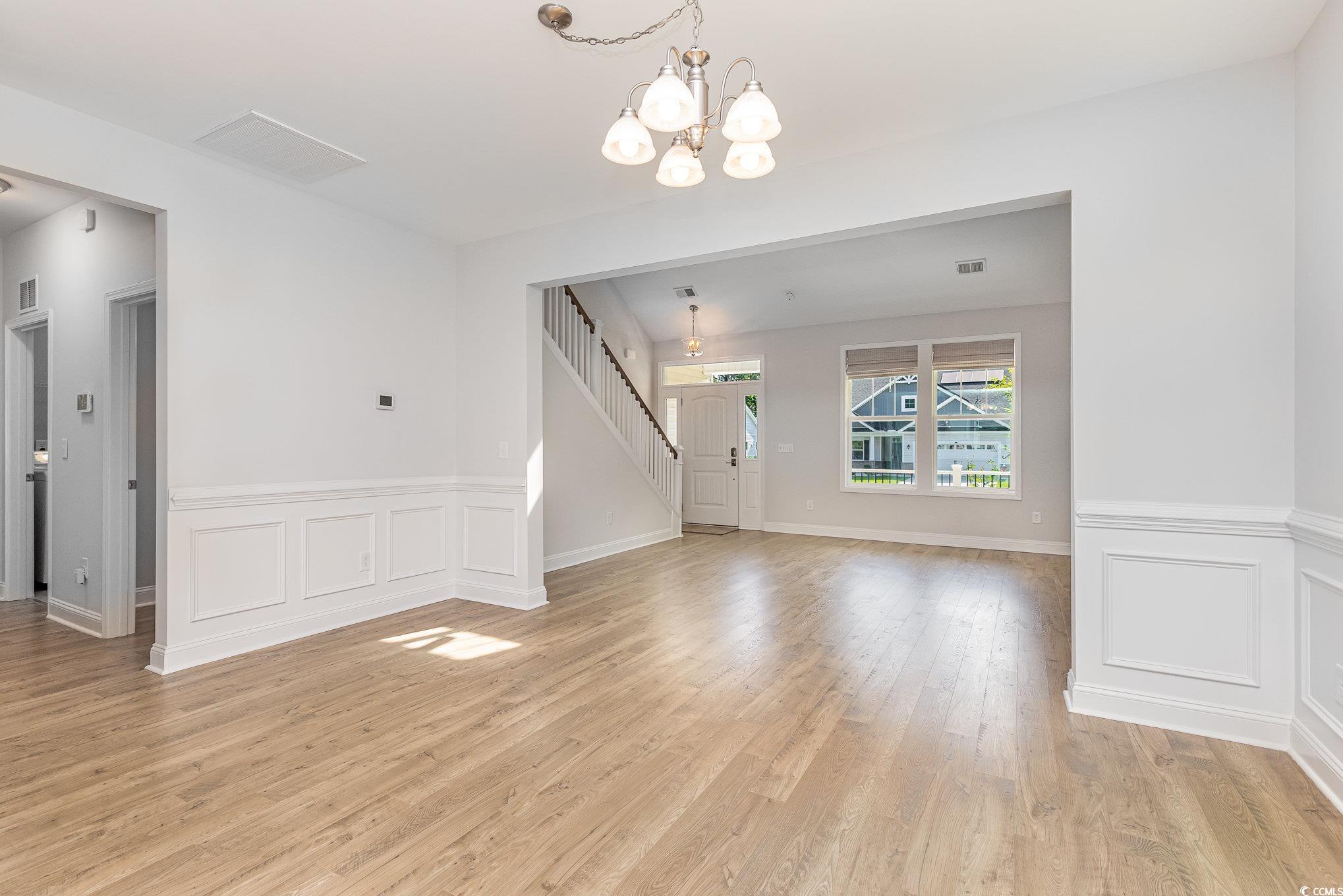 1438 Perch Place Longs, SC 29568 - Photo 7 of 39 Unfurnished living room featuring a chandelier and