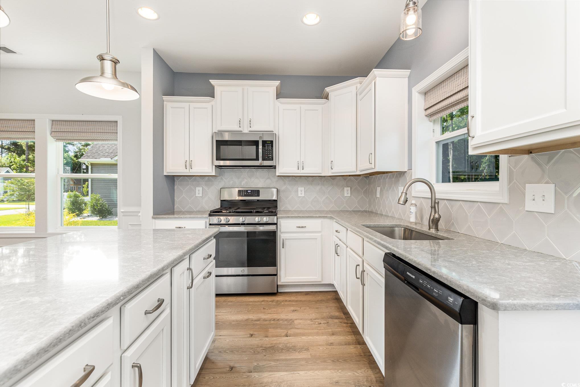 1438 Perch Place Longs, SC 29568 - Photo 9 of 39 Kitchen with tasteful backsplash, light wood-type